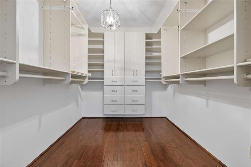 3035 Mt Zion Road Oxford, GA 30054 - Photo 60 of 99 wooden view of walk in closet with empty racks
