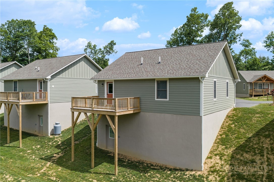 245 Ava Way, Unit 108 Boone, NC 28607 - Photo 8 of 31 a aerial view of a house next to a yard