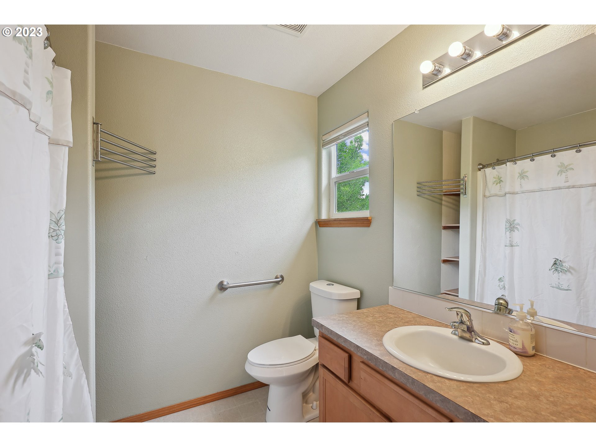 1132 Northeast 6th Street Gresham, OR 97030 - Photo 20 of 29 a bathroom with a granite countertop sink toilet a mirror and a shower