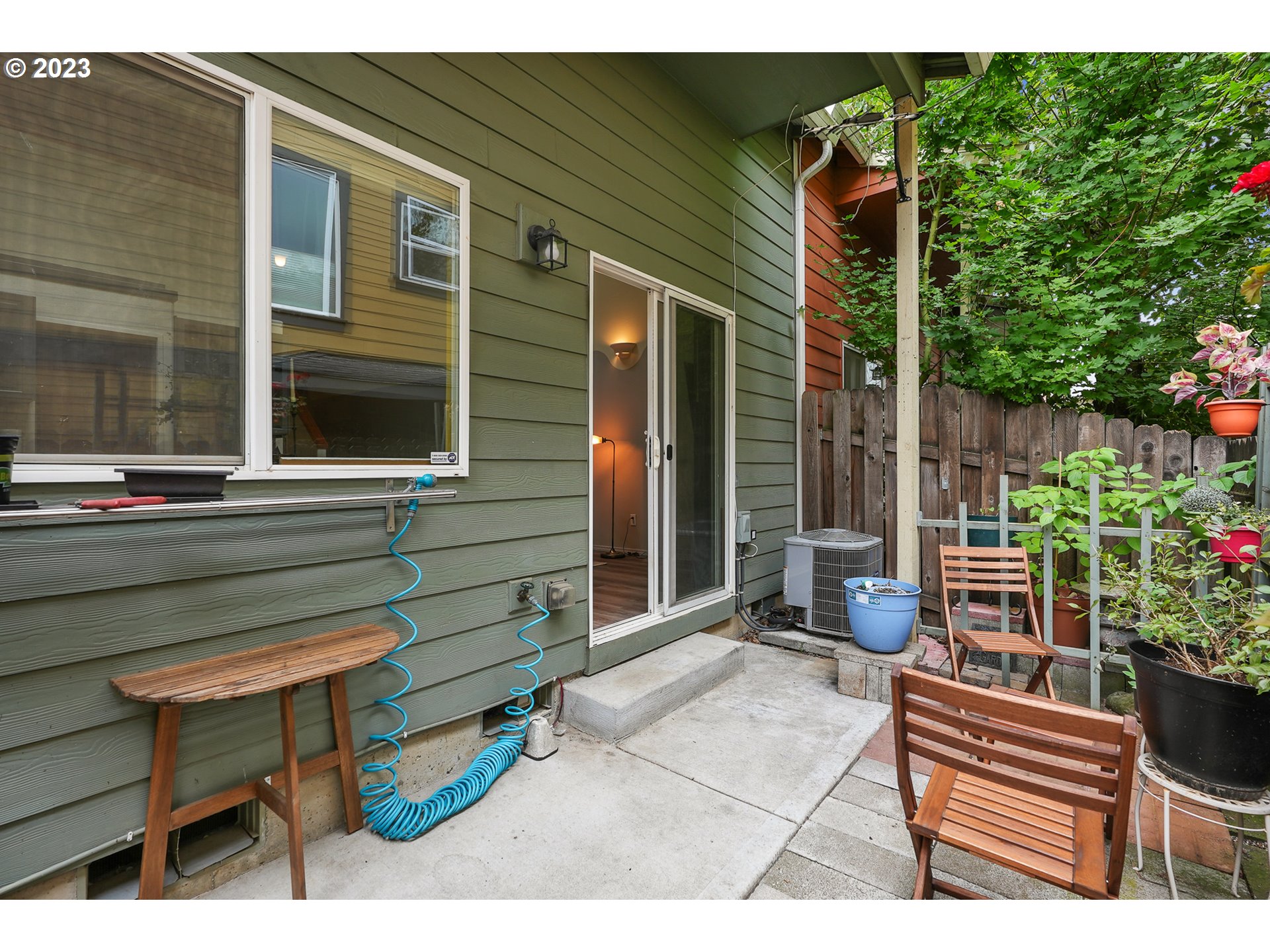 1132 Northeast 6th Street Gresham, OR 97030 - Photo 23 of 29 a backyard of a house with barbeque oven table and chairs