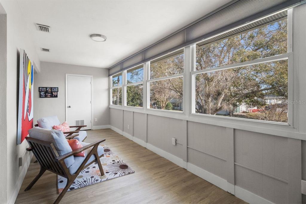 300 Clyde Lane, Unit 215 Dunedin, FL 34698 - Photo 21 of 60 a living room with furniture and a window