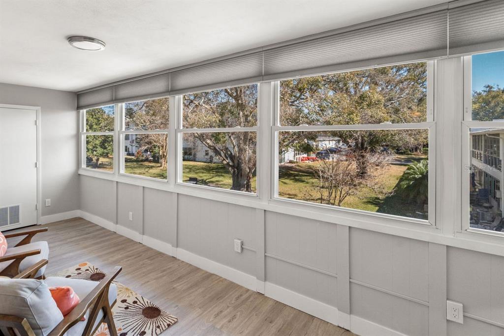 300 Clyde Lane, Unit 215 Dunedin, FL 34698 - Photo 23 of 60 a view of a room with furniture and large windows