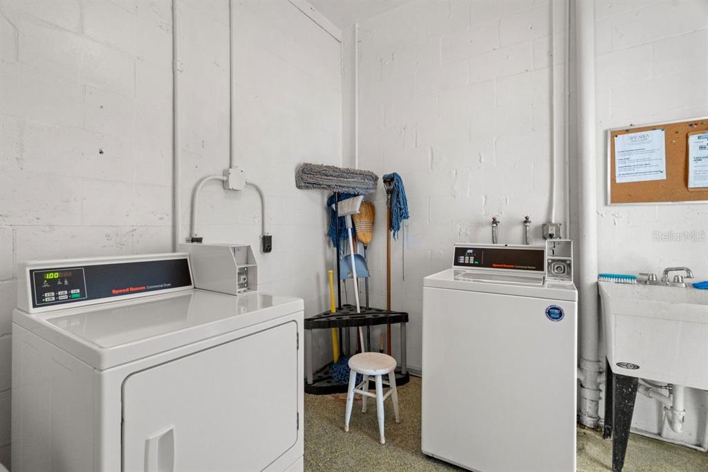 300 Clyde Lane, Unit 215 Dunedin, FL 34698 - Photo 26 of 60 a utility room with dryer and washer