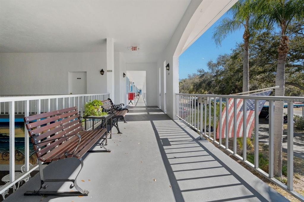 300 Clyde Lane, Unit 215 Dunedin, FL 34698 - Photo 27 of 60 a view of balcony with wooden floor