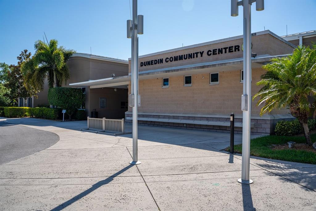 300 Clyde Lane, Unit 215 Dunedin, FL 34698 - Photo 53 of 60 a front view of a building with garden