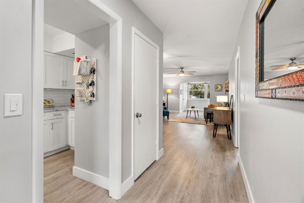 300 Clyde Lane, Unit 215 Dunedin, FL 34698 - Photo 10 of 60 a view of a living room and a wooden floor