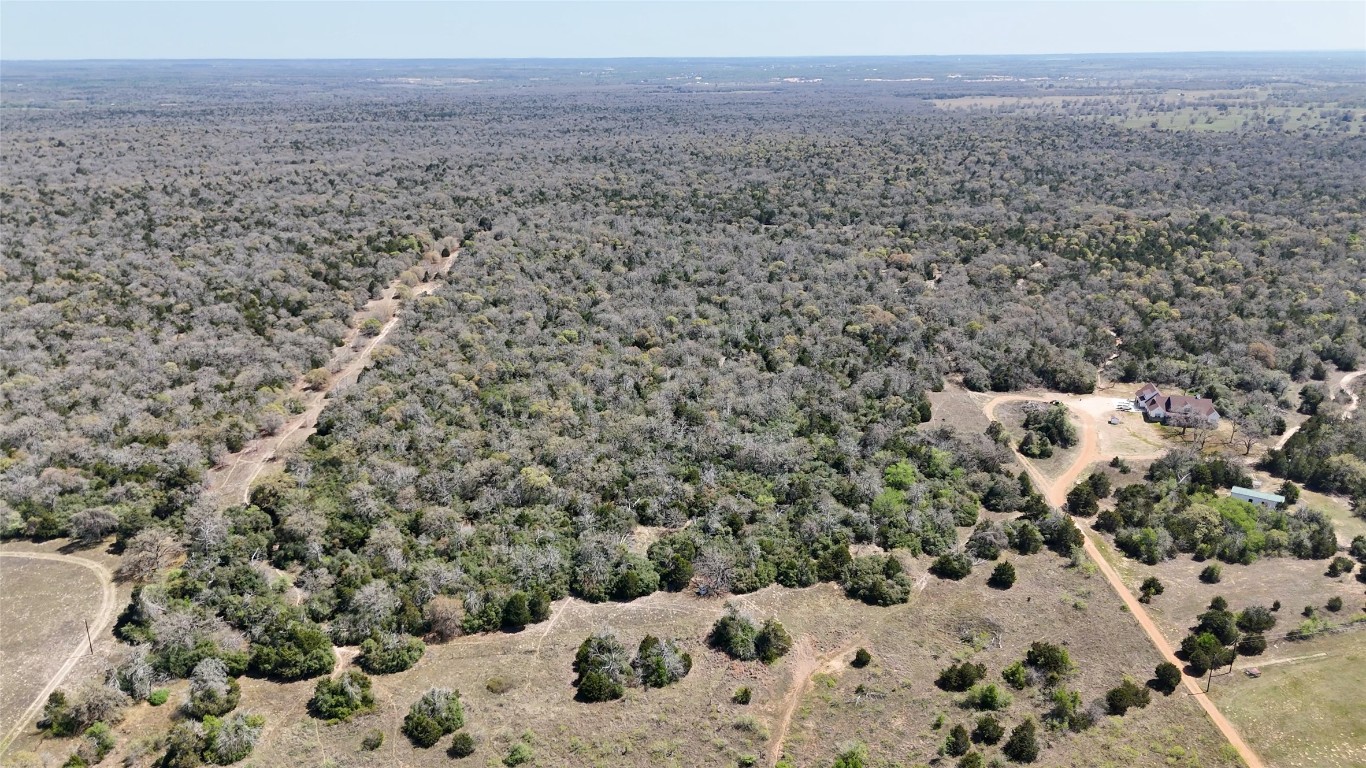 Tbd Wilson Road Elgin, TX 78621 - Photo 3 of 20 a view of a yard covered in snow