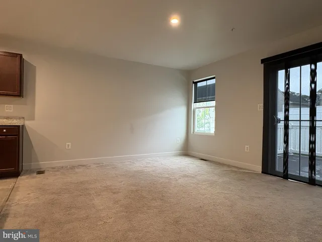 a view of balcony with wooden floor and fence