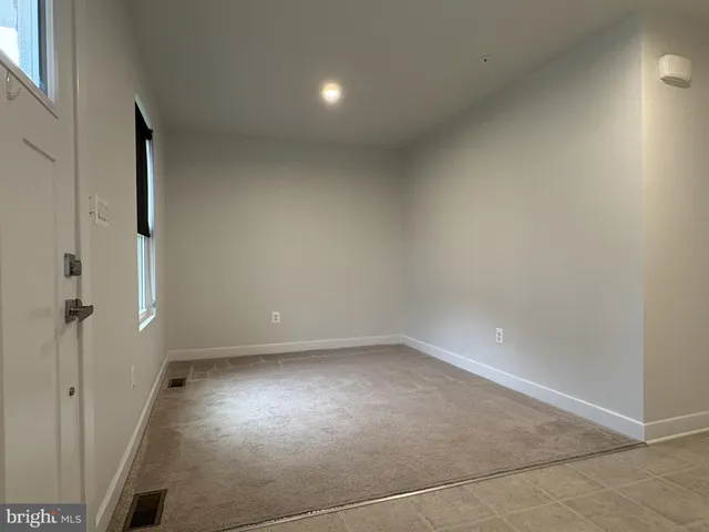 an empty room with a empty space and window