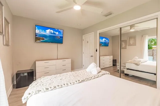 a bedroom with a bed and a view of bathroom