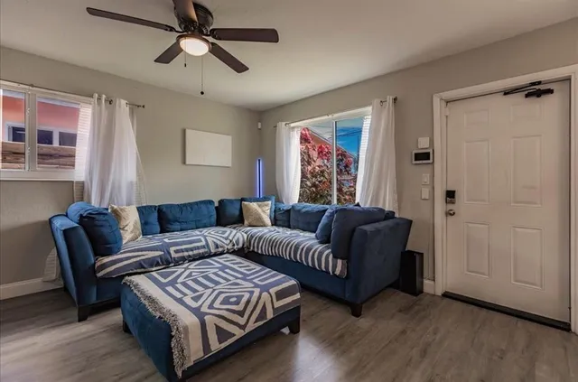 a living room with furniture and a window