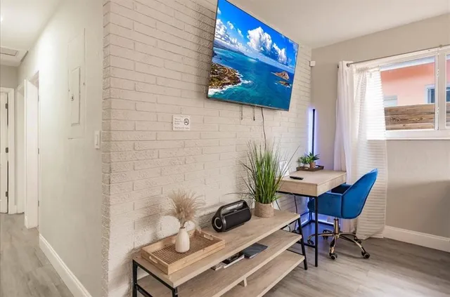 a view of a workspace with furniture