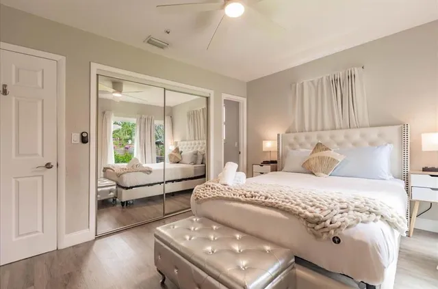 a bedroom with a bed and a couch