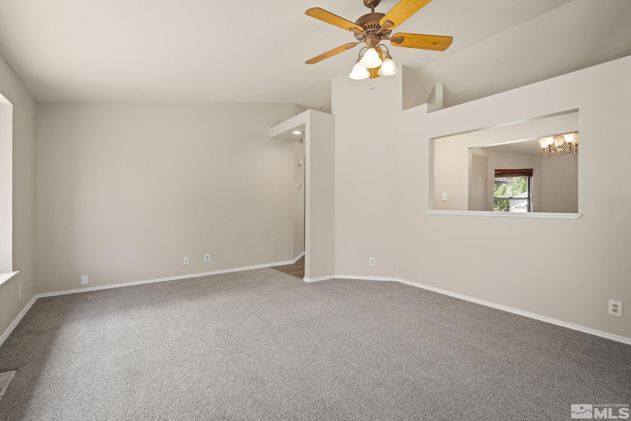 540 Citadel Road Reno, NV 89503 - Photo 7 of 30 an empty room with windows and fan