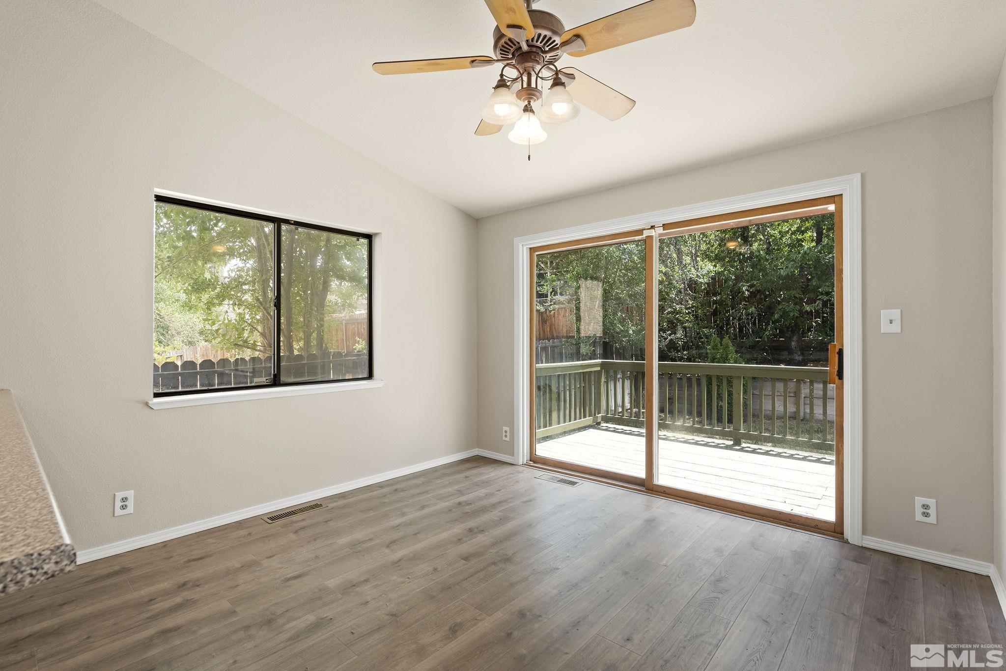 540 Citadel Road Reno, NV 89503 - Photo 8 of 30 a view of an empty room with wooden floor and a window