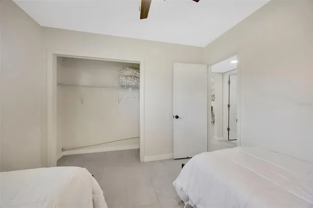 a bedroom with a bed and a shower