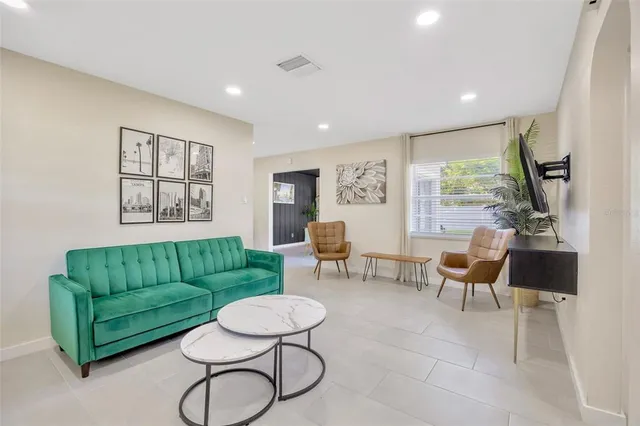 a living room with furniture and a large window