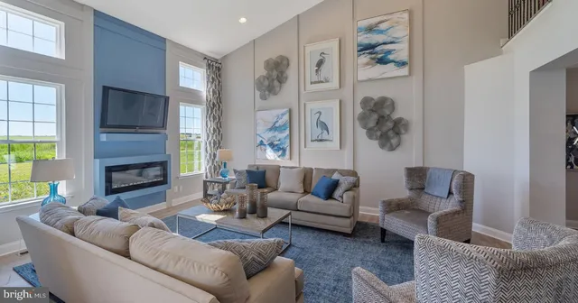 a living room with fireplace furniture and a window