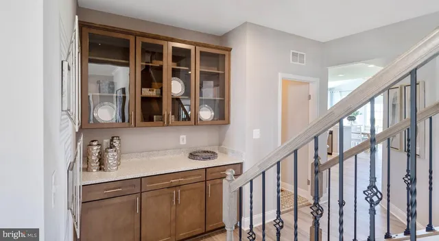 a view of an entryway with wooden floor and stairs