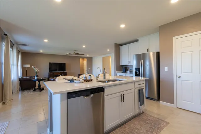 a kitchen with a sink and refrigerator
