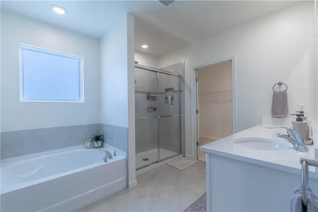 a bathroom with a bathtub and a sink