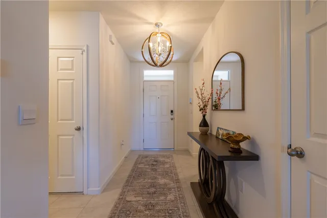 a view of a entryway door with wooden floor