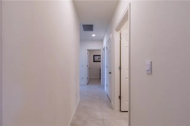 a view of a hallway with some rooms