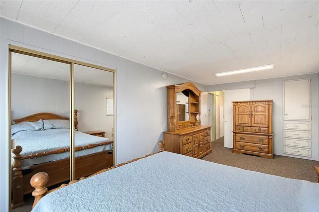 a bedroom with a bed and a cabinets