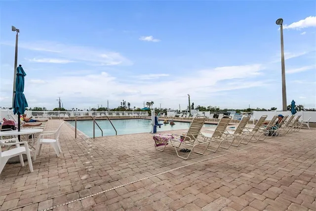 a view of a lake with outdoor seating space