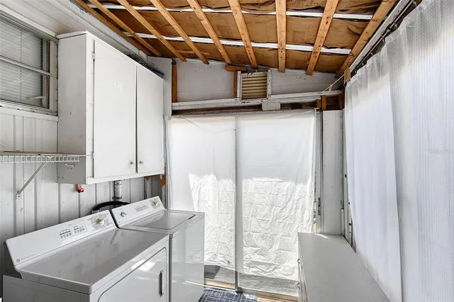 a kitchen with a sink a counter top space and stainless steel appliances