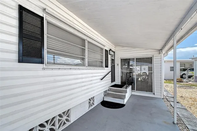 a view of front door and bedroom