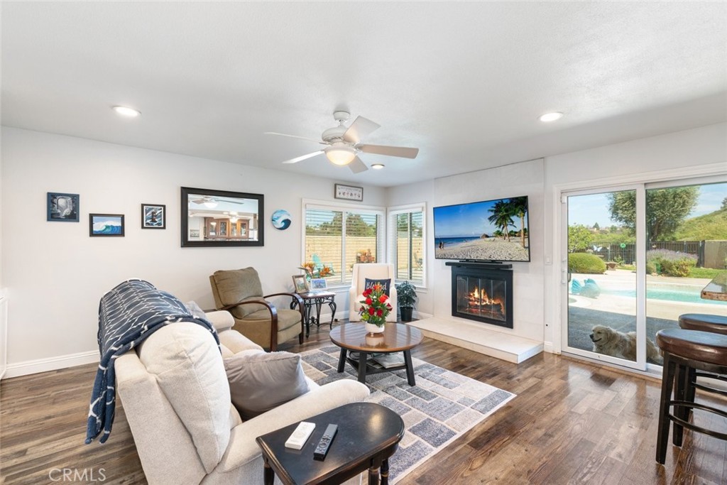 30198 La Primavera Street Temecula, CA 92592 - Photo 15 of 50 a living room with furniture and a fireplace