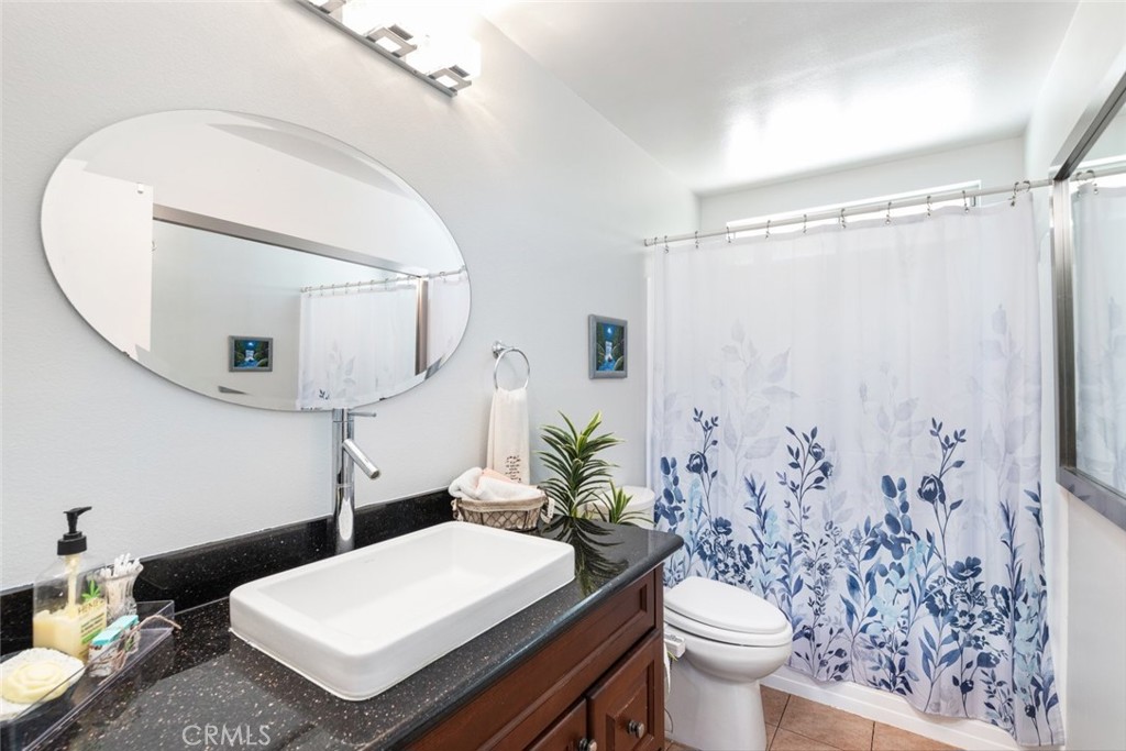 30198 La Primavera Street Temecula, CA 92592 - Photo 20 of 50 a bathroom with a sink toilet and mirror