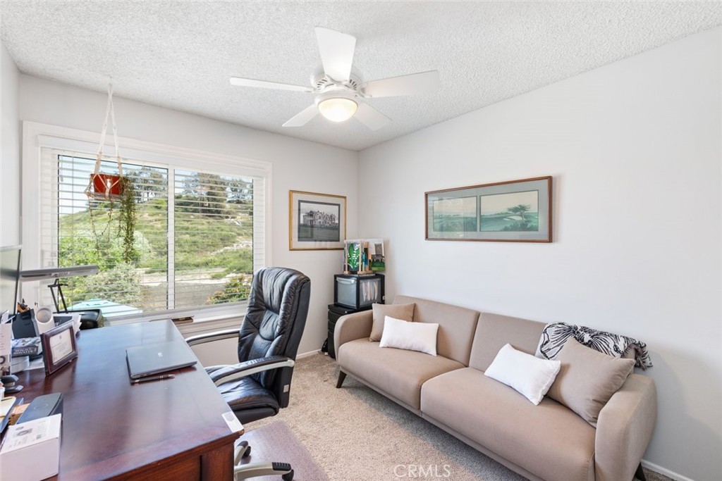 30198 La Primavera Street Temecula, CA 92592 - Photo 21 of 50 a living room with furniture and a large window