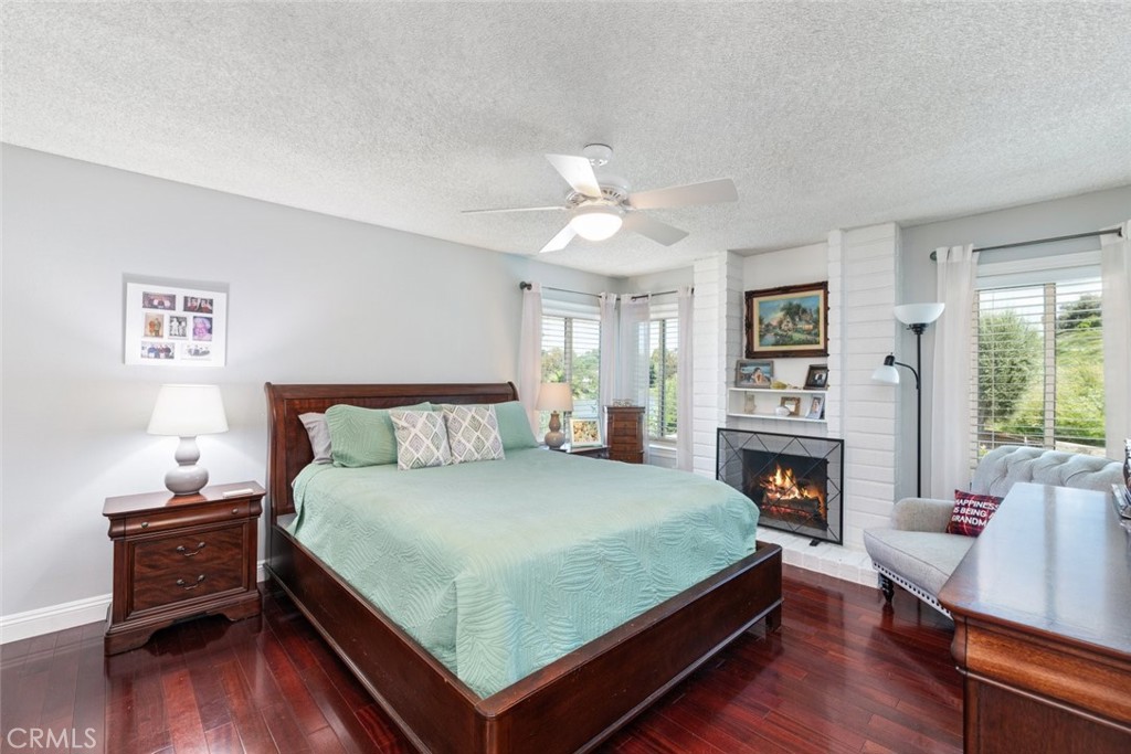30198 La Primavera Street Temecula, CA 92592 - Photo 23 of 50 a bedroom with a bed flat screen tv and window