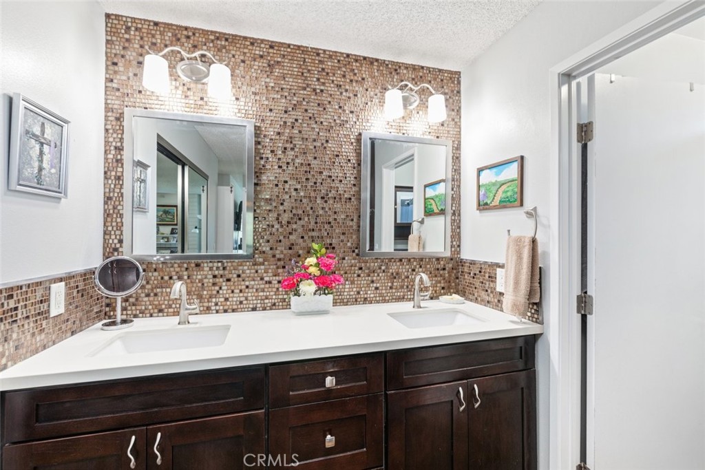 30198 La Primavera Street Temecula, CA 92592 - Photo 25 of 50 a bathroom with a sink and a mirror