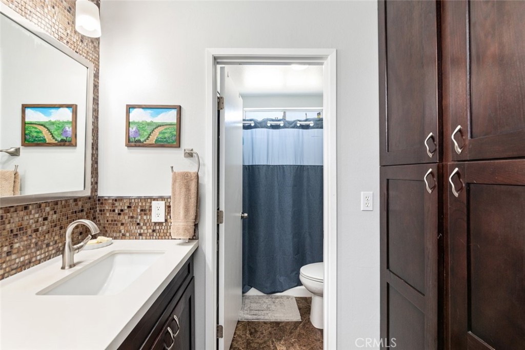 30198 La Primavera Street Temecula, CA 92592 - Photo 26 of 50 a bathroom with a sink a toilet and shower