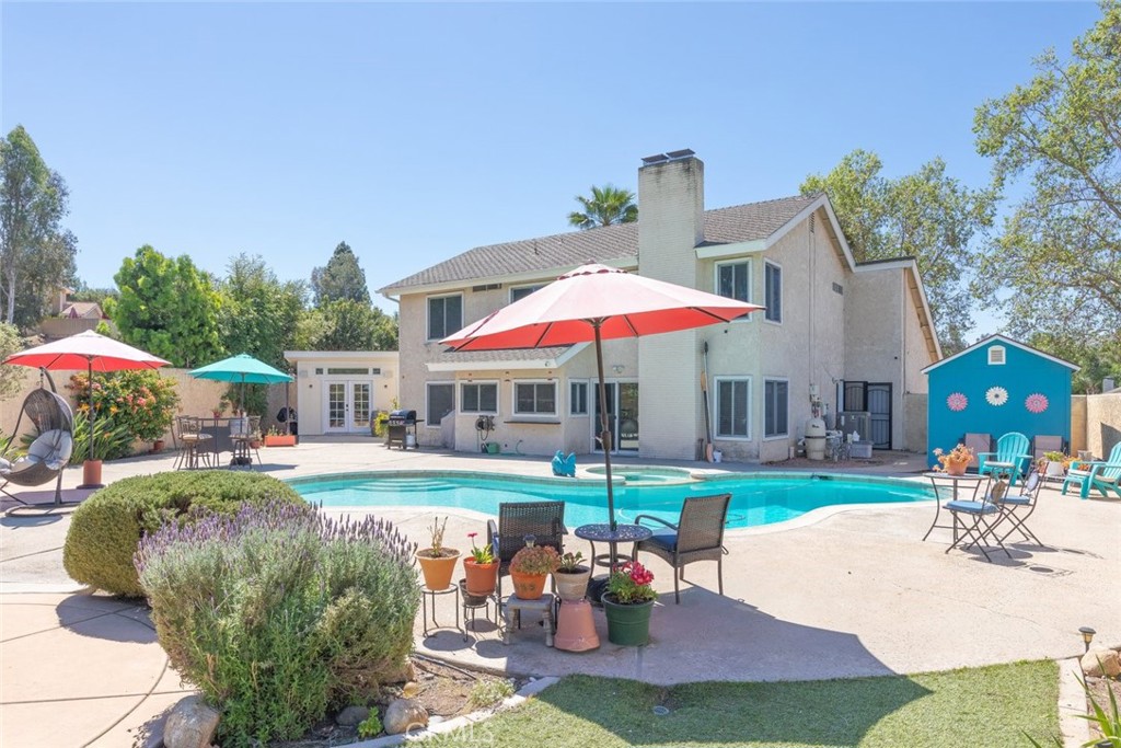 30198 La Primavera Street Temecula, CA 92592 - Photo 29 of 50 a view of a house with garden and a patio