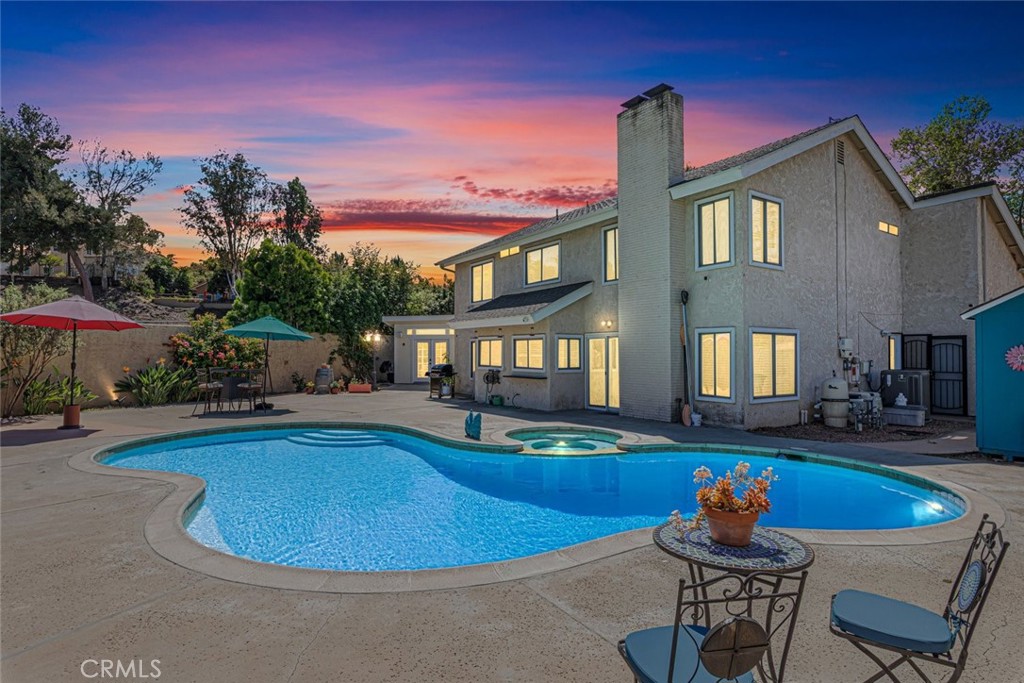 30198 La Primavera Street Temecula, CA 92592 - Photo 31 of 50 a view of a house with swimming pool and sitting area