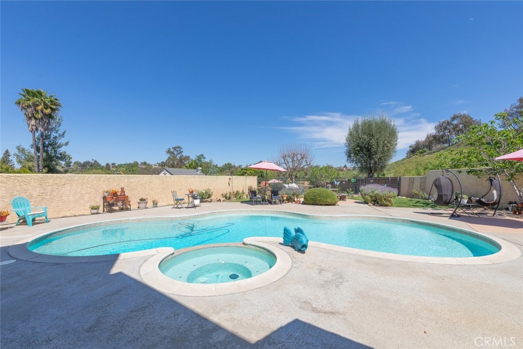 30198 La Primavera Street Temecula, CA 92592 - Photo 35 of 50 a view of a swimming pool and a yard