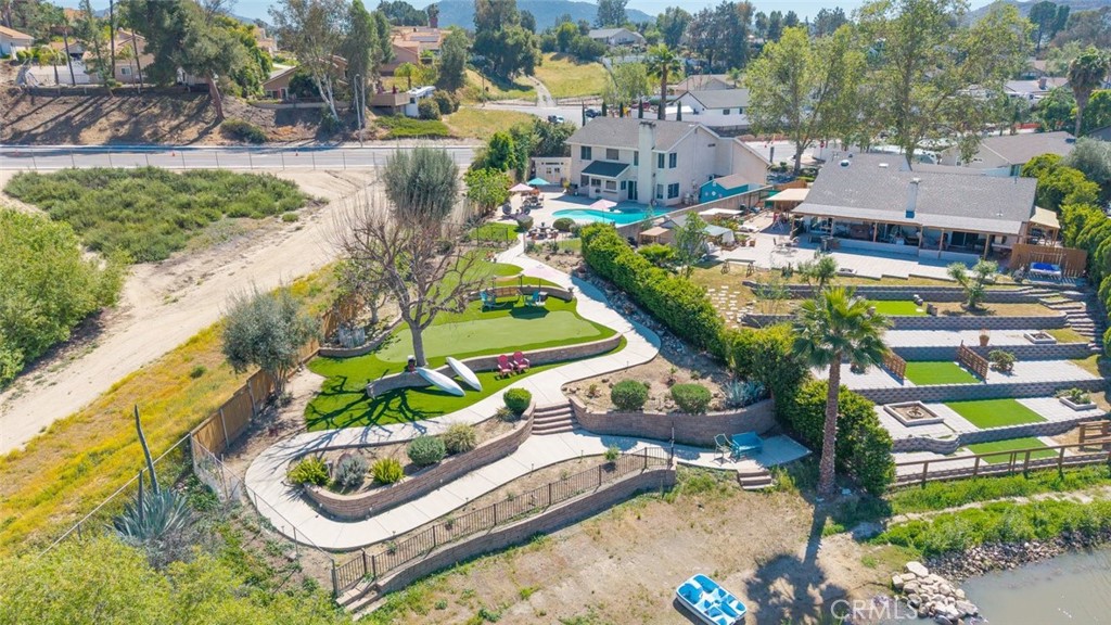 30198 La Primavera Street Temecula, CA 92592 - Photo 45 of 50 an aerial view of a house with a yard and lake