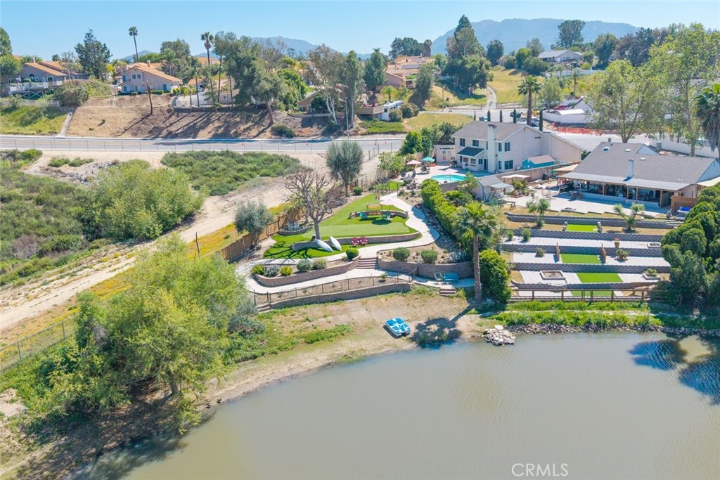 30198 La Primavera Street Temecula, CA 92592 - Photo 46 of 50 an aerial view of a house with a garden and lake view
