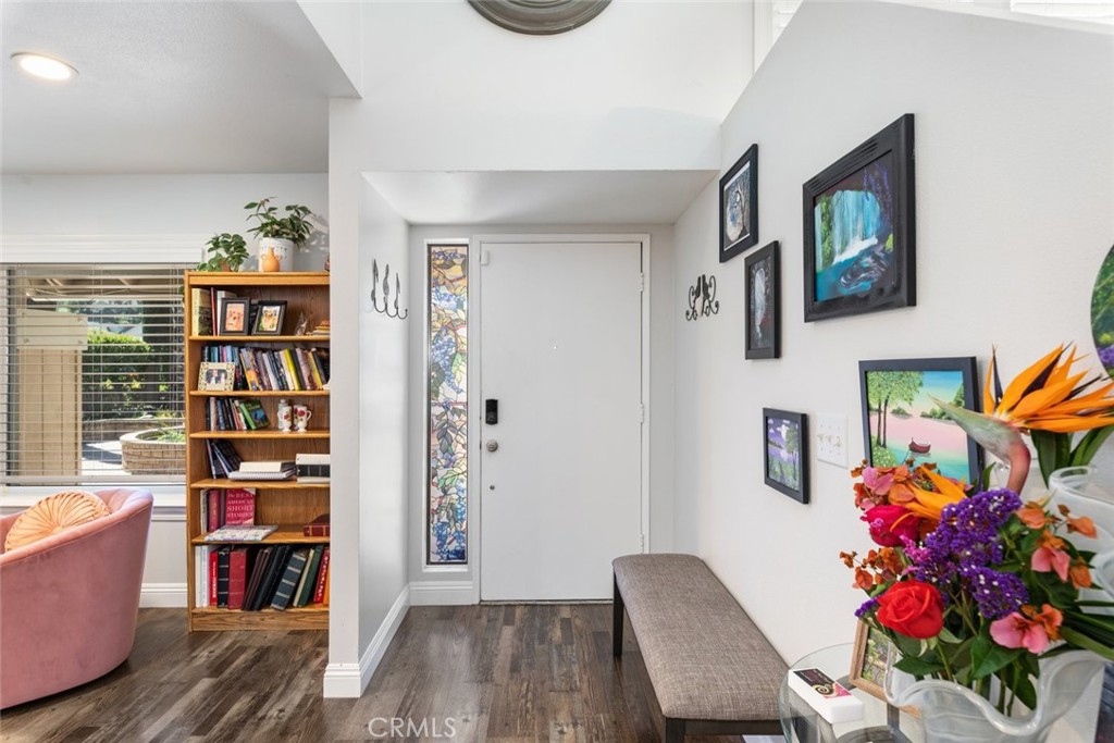 30198 La Primavera Street Temecula, CA 92592 - Photo 5 of 50 a living room with furniture and book shelf