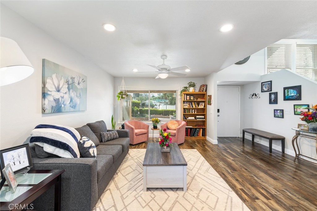 30198 La Primavera Street Temecula, CA 92592 - Photo 7 of 50 a living room with furniture fireplace and wooden floor