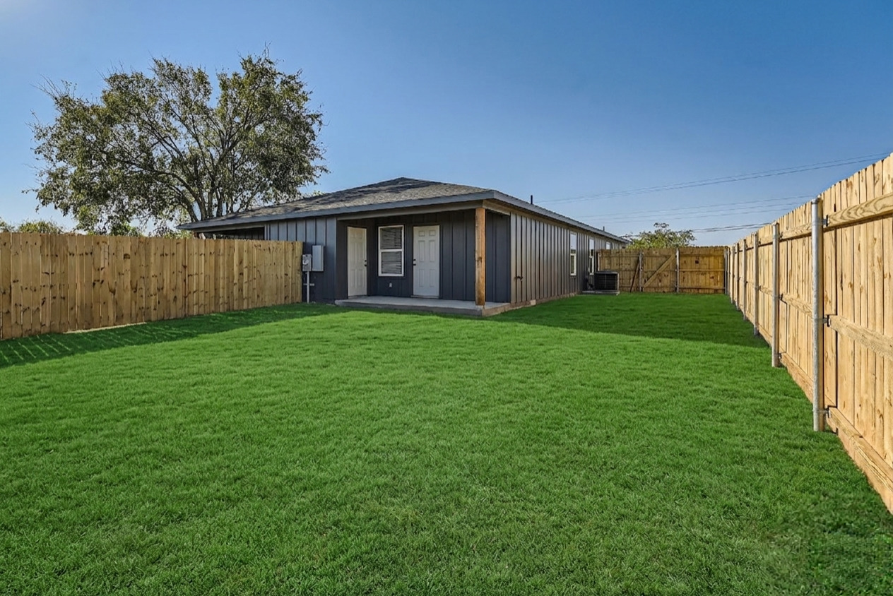 111 Fisher Street, Unit A & B Elgin, TX 78621 - Photo 10 of 13 a view of a house with a yard