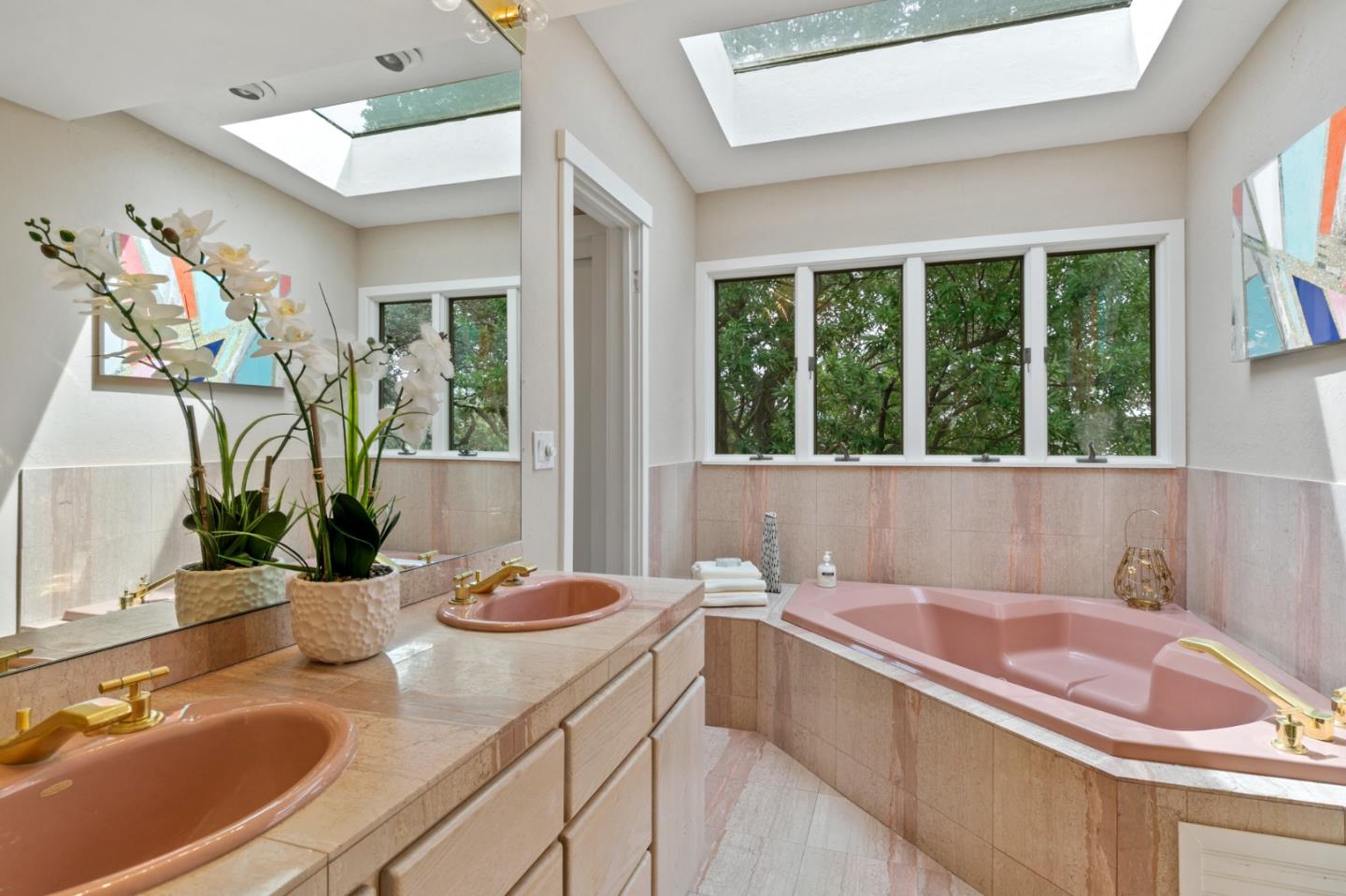 30 Knollcrest Road Hillsborough, CA 94010 - Photo 19 of 33 a bathroom with a granite countertop tub a sink and a large mirror next to a window