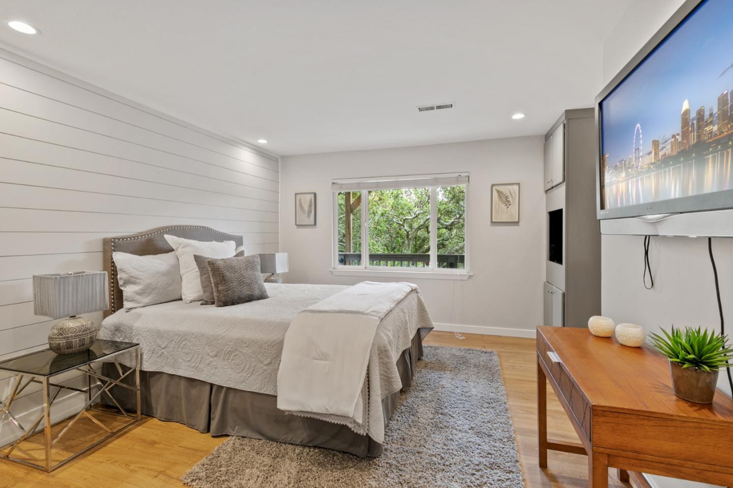 30 Knollcrest Road Hillsborough, CA 94010 - Photo 26 of 33 a bedroom with a large bed and potted plant on table