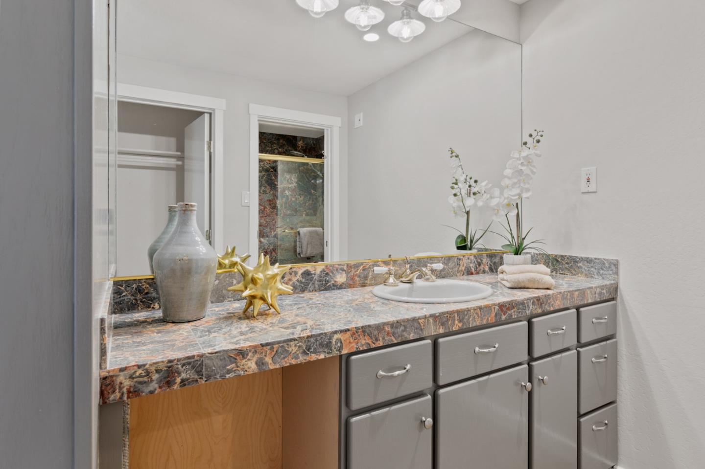 30 Knollcrest Road Hillsborough, CA 94010 - Photo 27 of 33 a bathroom with a granite countertop sink and a mirror