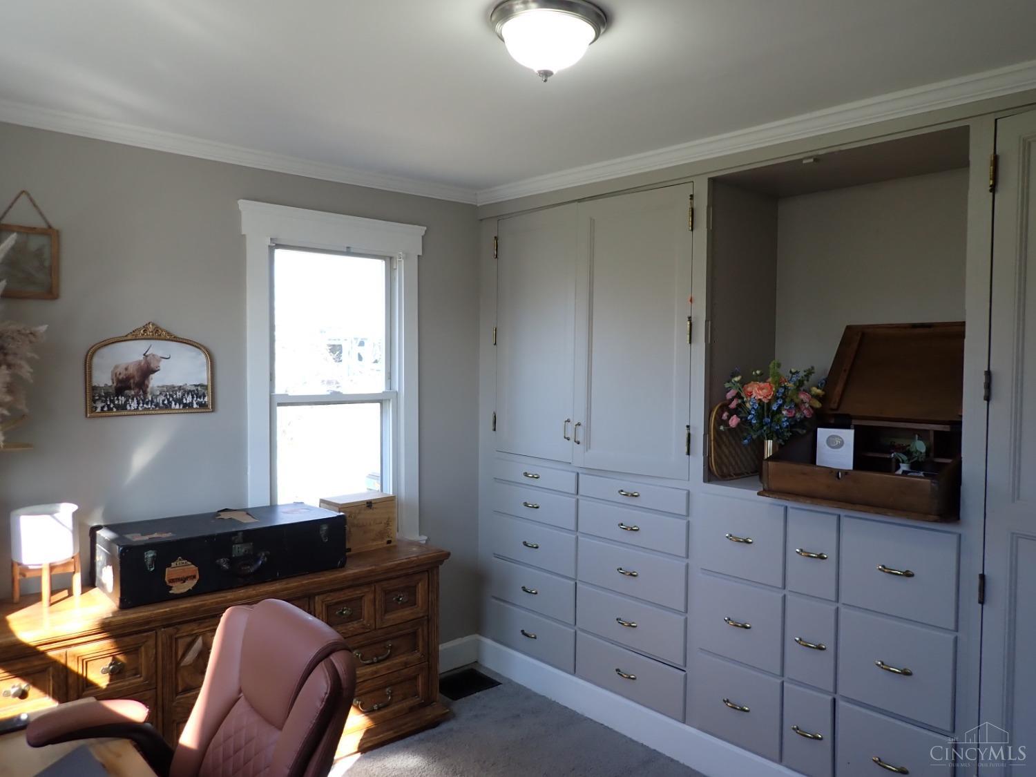 4406 East Galbraith Road Cincinnati, OH 45236 - Photo 8 of 19 Beautiful built-in storage in first floor bedroom.