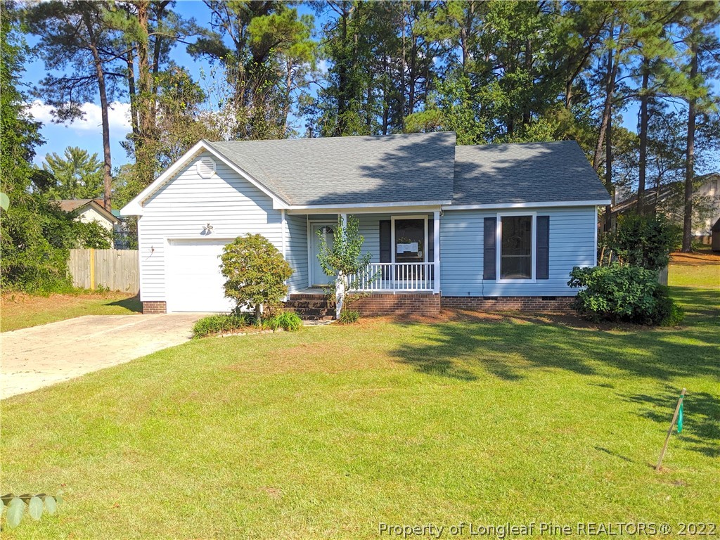 6653 Vaughn Road Fayetteville, NC 28304 - Photo 1 of 7 a view of a house with pool and chairs